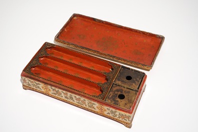 A rectangular laquered papier mache qalamdan or pen holder, Qajar, Iran, 19th C.