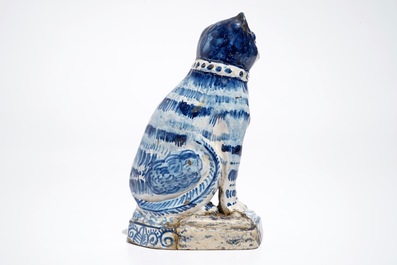 A Dutch Delft blue and white model of a cat, 1st half 19th C.