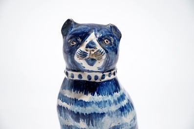 A Dutch Delft blue and white model of a cat, 1st half 19th C.