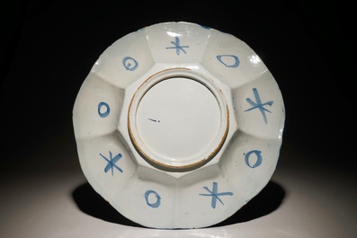 A Dutch Delft blue and white gadrooned chinoiserie dish, 2nd half 17th C.