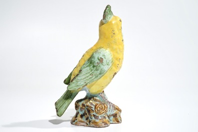 A polychrome Dutch Delft or French faience model of a bird, 18/19th C.