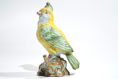 A polychrome Dutch Delft or French faience model of a bird, 18/19th C.