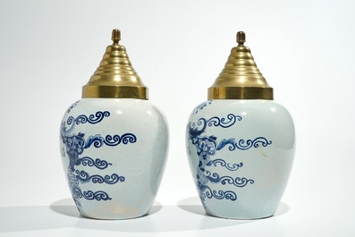 A pair of Dutch Delft blue and white tobacco jars, 19th C.