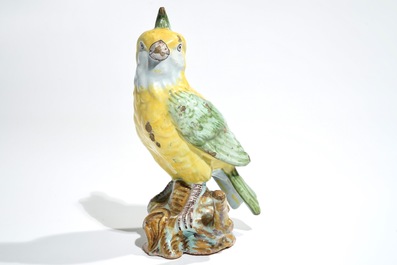 A polychrome Dutch Delft or French faience model of a bird, 18/19th C.