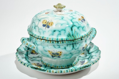 A polychrome Brussels faience tureen on stand with butterflies and caterpillars, 18/19th C.