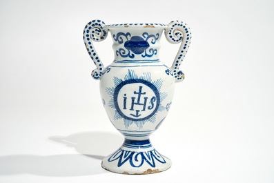 A Dutch Delft blue and white altar vase with IHS inscription, 18th C.