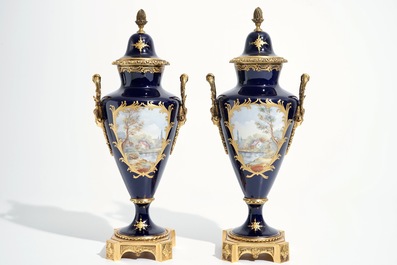 A pair of bronze-mounted Sevres style porcelain vases and covers, 19/20th C.