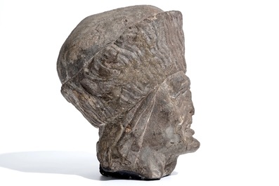 A Flemish carved stone bishop's head, 15/16th C.