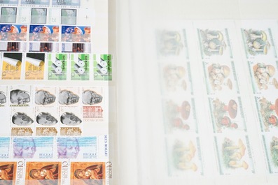 A large collection of stamps and coins, mostly Belgium and Belgian Congo