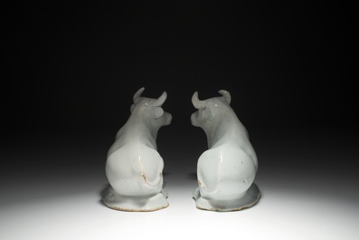 A pair of white Dutch Delft resting cows, 18th C.