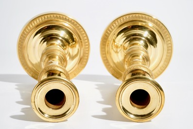 A pair of gilt bronze Empire candlesticks, France, 19th C.