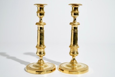 A pair of gilt bronze Empire candlesticks, France, 19th C.