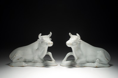 A pair of white Dutch Delft resting cows, 18th C.