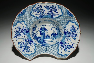 A Dutch Delft blue and white chinoiserie shaving bowl, 18th C.