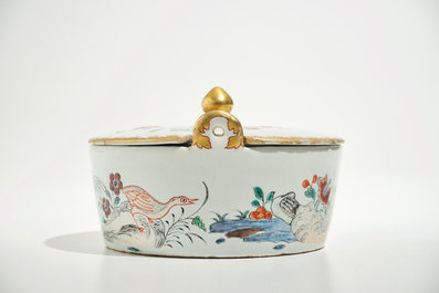 A polychrome Dutch Delft petit feu butter tub after a Chinese famille rose example, 18th C.