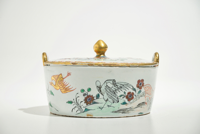 A polychrome Dutch Delft petit feu butter tub after a Chinese famille rose example, 18th C.