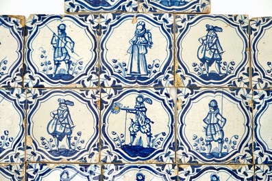 A field of 22 Dutch Delft blue and white tiles with soldiers after Jacob de Gheyn, 17th C.