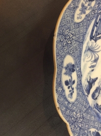 A pair of Chinese blue and white plates with animals in a garden, Qianlong