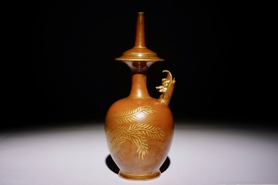 A Chinese monochrome persimmon-glazed kundika with applied gilt decoration, 18/19th C.