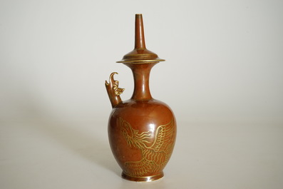 A Chinese monochrome persimmon-glazed kundika with applied gilt decoration, 18/19th C.