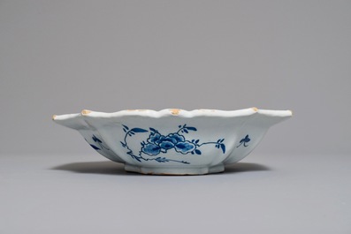 A Dutch Delft blue and white salad bowl with lotus scrolls, 18th C.