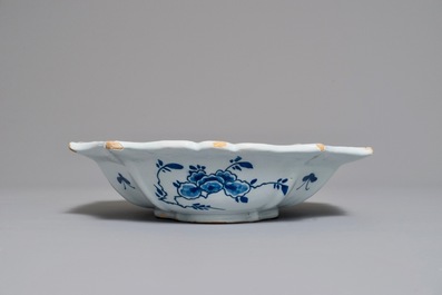 A Dutch Delft blue and white salad bowl with lotus scrolls, 18th C.