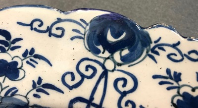 A pair of Dutch Delft blue and white &quot;Tea Tree&quot; dishes and a dish with a flower basket, 18th C.