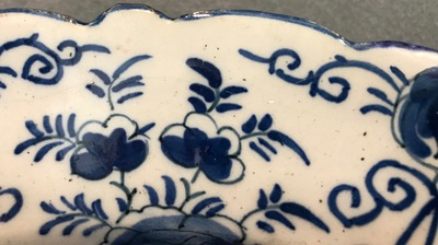 A pair of Dutch Delft blue and white &quot;Tea Tree&quot; dishes and a dish with a flower basket, 18th C.