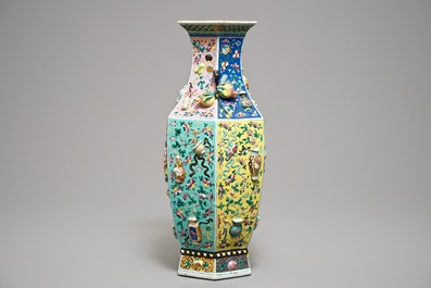 A hexagonal Chinese famille rose vase with applied design, 19th C.