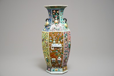 A hexagonal Chinese famille rose vase with applied design, 19th C.