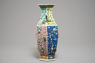 A hexagonal Chinese famille rose vase with applied design, 19th C.