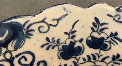 A pair of Dutch Delft blue and white &quot;Tea Tree&quot; dishes and a dish with a flower basket, 18th C.