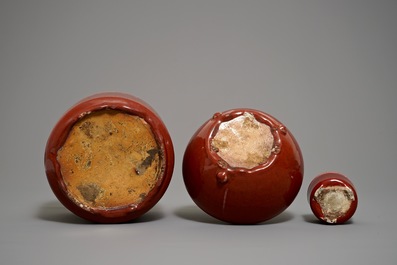 Two Chinese oxblood-glazed brush pots and an incense burner, 19/20th C.