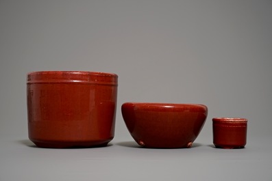 Two Chinese oxblood-glazed brush pots and an incense burner, 19/20th C.