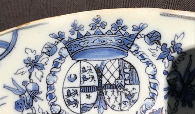 A Dutch Delft blue and white armorial plate, 17th C.