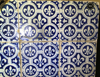 A field of 24 Dutch Delft blue and white tiles with Fleur de Lys, 17th C.