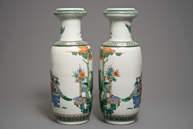 A pair of large Chinese famille verte figural rouleau vases, 19th C.