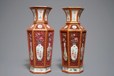 A pair of reticulated double-walled hexagonal Chinese famille rose vases, Yongzheng