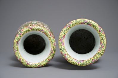 A pair of Chinese pink ground Canton vases, 19th C.