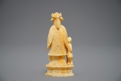 A Chinese pierced ivory basket and a small group of a lady with child, 19th C.