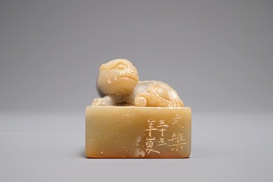 An inscribed and dated Chinese Shoushan stone seal with a Buddhist lion