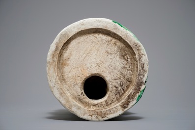 A Chinese verte biscuit group of Guanyin on a lotus throne, 18th C.