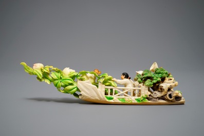 A Chinese polychrome ivory group of children hunting butterflies, first half 20th C.