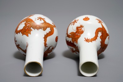 A pair of Chinese iron red and gilt bottle vases with dragons, Wanli mark, 19th C.