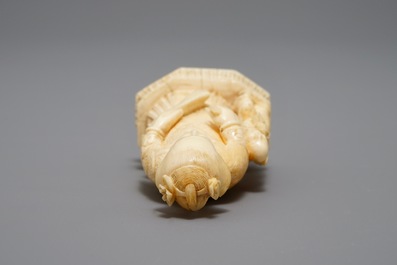 A Chinese pierced ivory basket and a small group of a lady with child, 19th C.