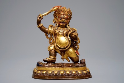 A Sino-Tibetan gilt bronze figure of Mahakala, 19th C.