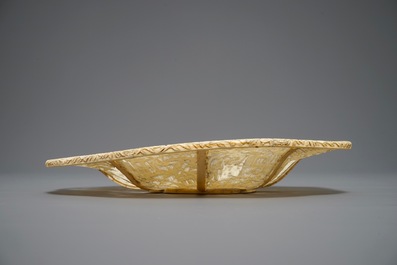 A Chinese pierced ivory basket and a small group of a lady with child, 19th C.