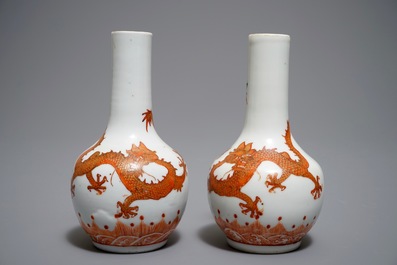 A pair of Chinese iron red and gilt bottle vases with dragons, Wanli mark, 19th C.