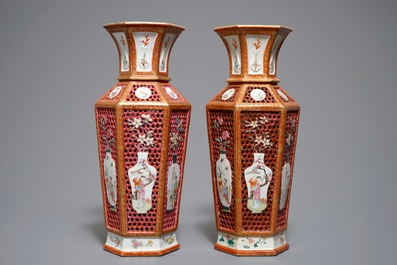 A pair of reticulated double-walled hexagonal Chinese famille rose vases, Yongzheng