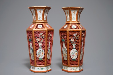 A pair of reticulated double-walled hexagonal Chinese famille rose vases, Yongzheng